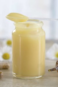 Royal jelly from honeybees in a glass jar. 